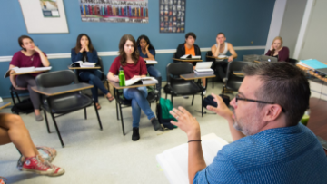 Professor leads class discussion.