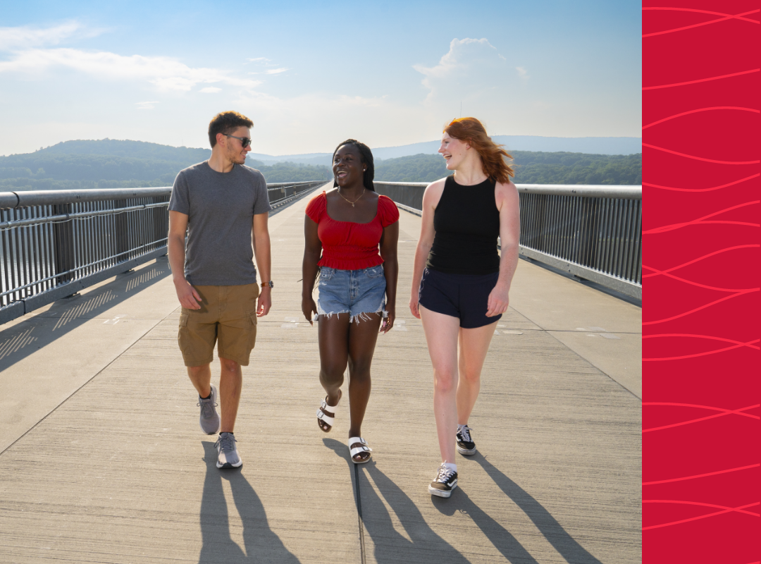 Students walking on a bridge over the Hudson.