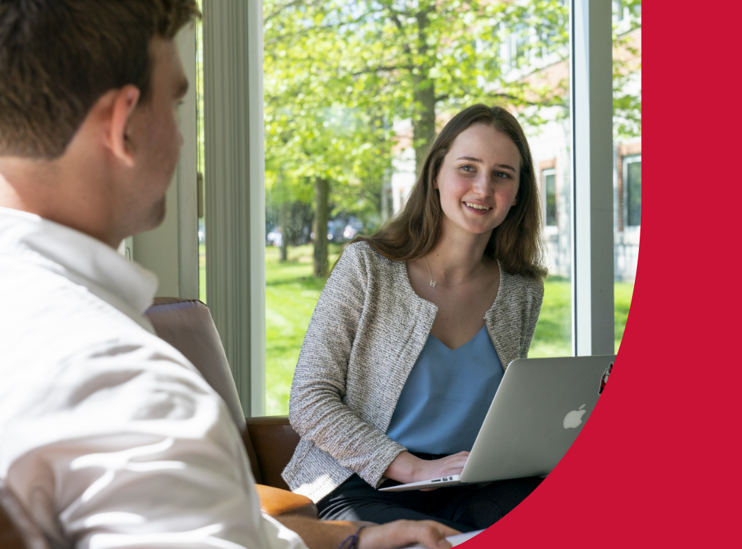 A student and an advisor talking.