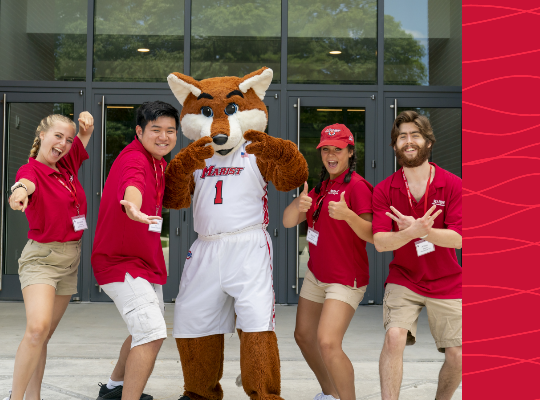 Students posing with the Red Fox mascot.