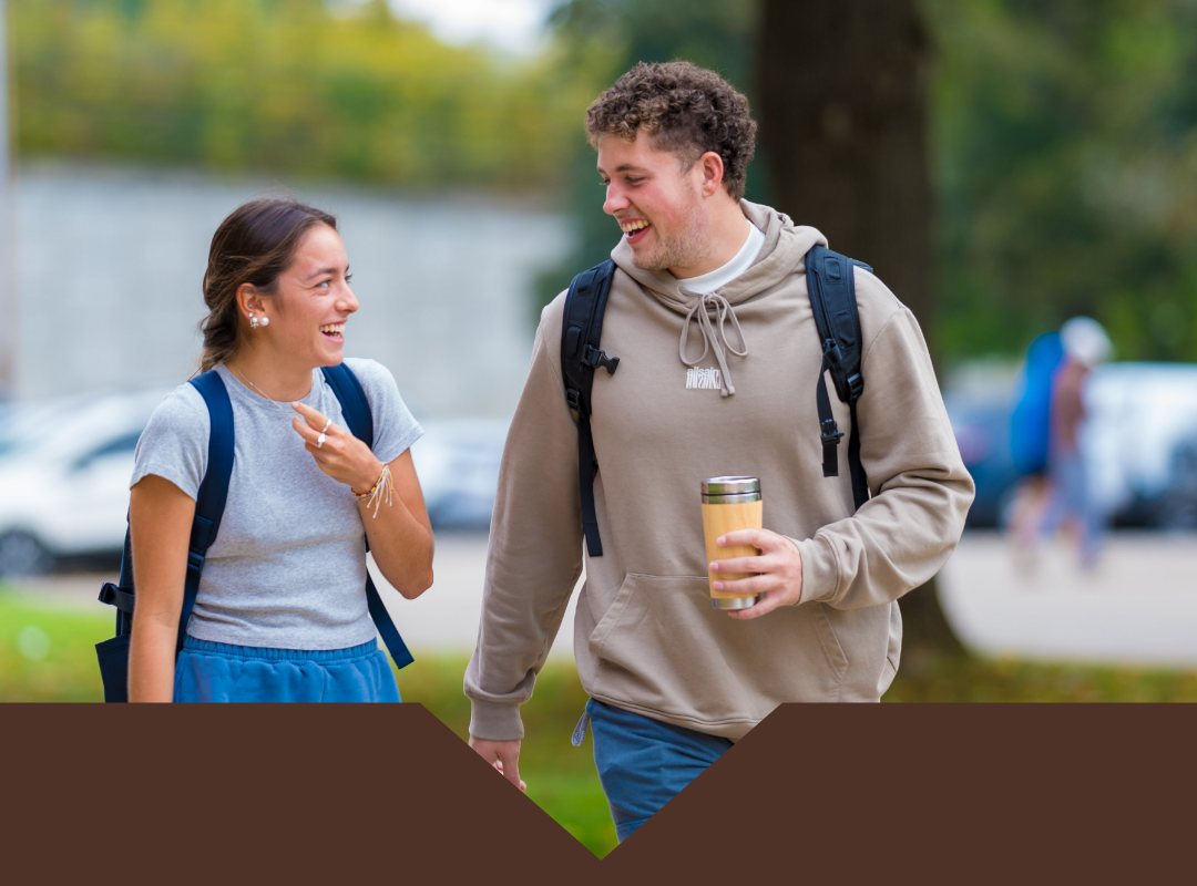 Two students walking on campus