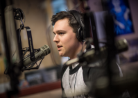 Student speaks into microphone. 