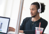 Student works on computer. 