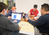 Four students work on project. 